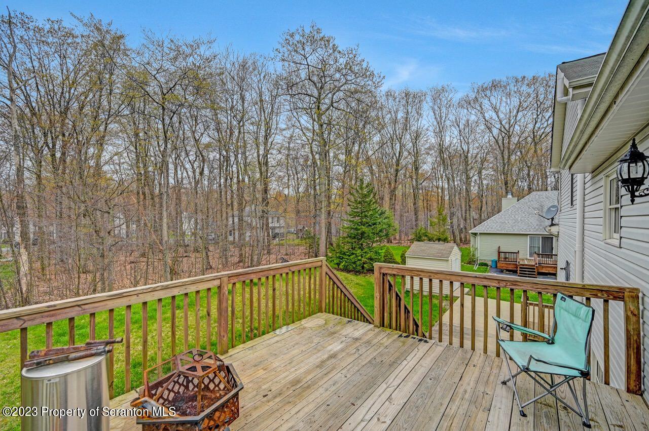 4156 Romeo Road Tobyhanna, PA 18466 - Photo 38 of 46 a view of a wooden chairs and table on the deck