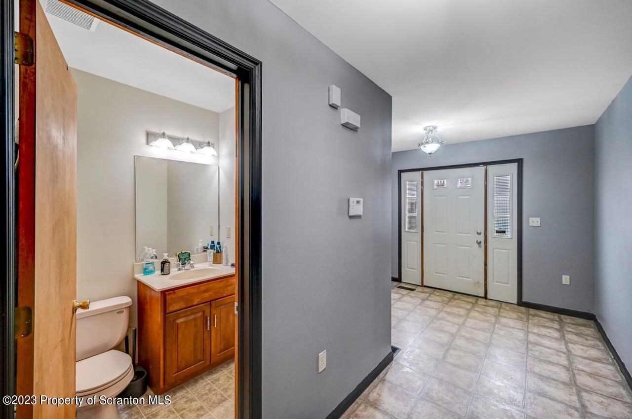 4156 Romeo Road Tobyhanna, PA 18466 - Photo 6 of 46 a bathroom with a sink and a mirror