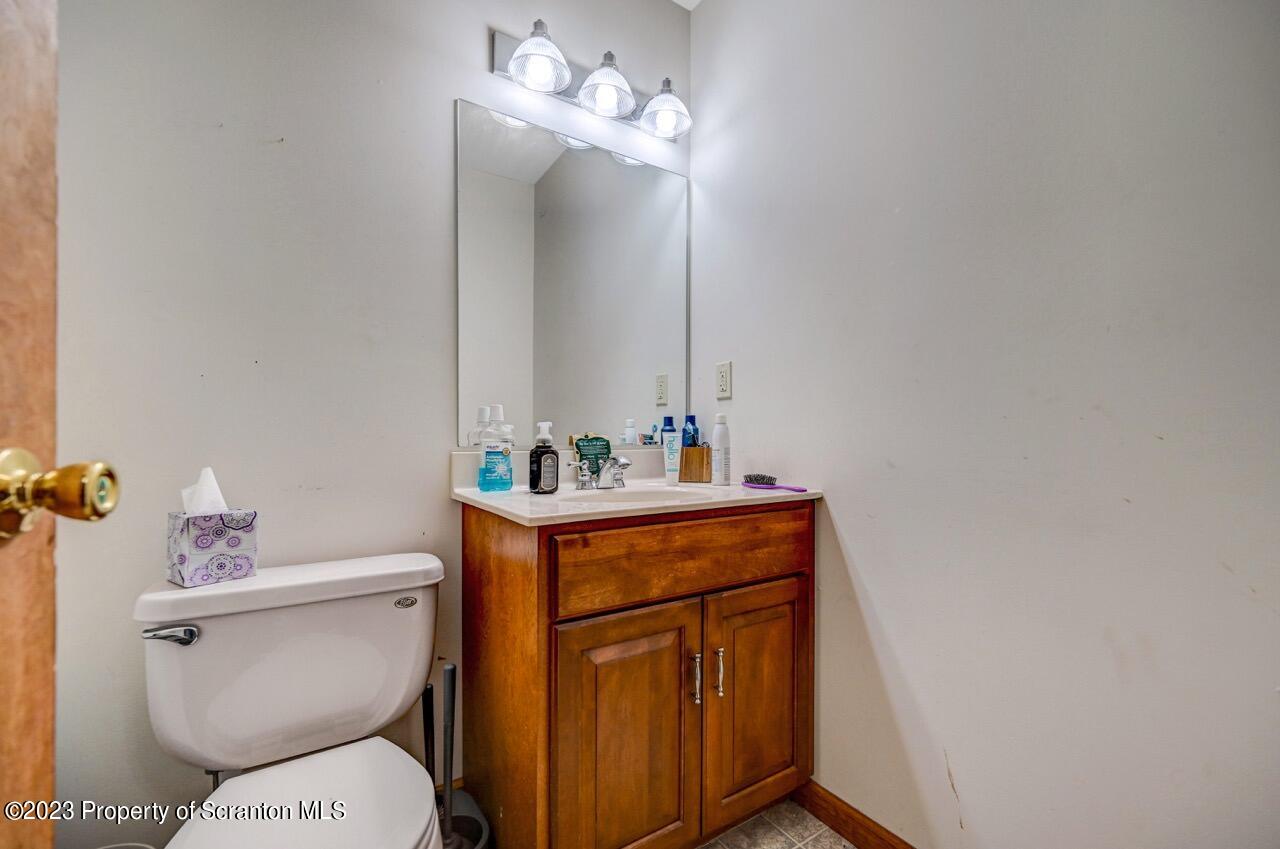 4156 Romeo Road Tobyhanna, PA 18466 - Photo 7 of 46 a bathroom with a sink a toilet and a mirror