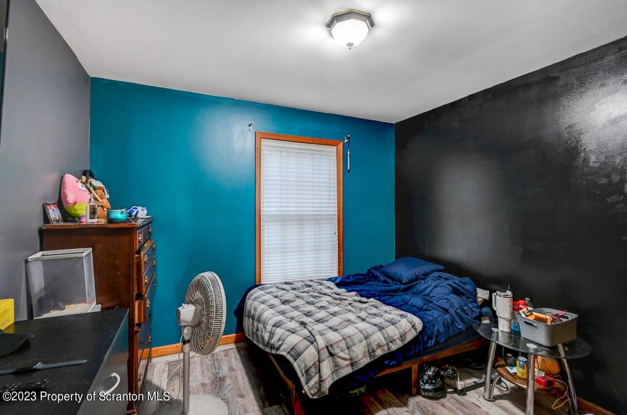 4156 Romeo Road Tobyhanna, PA 18466 - Photo 8 of 46 a bedroom with a bed and wooden floor