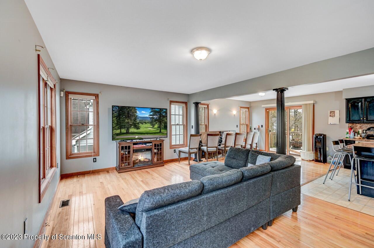 4156 Romeo Road Tobyhanna, PA 18466 - Photo 10 of 46 a living room with furniture and a flat screen tv