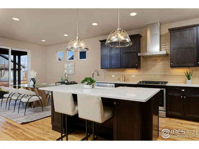 a kitchen with a table and chairs in it