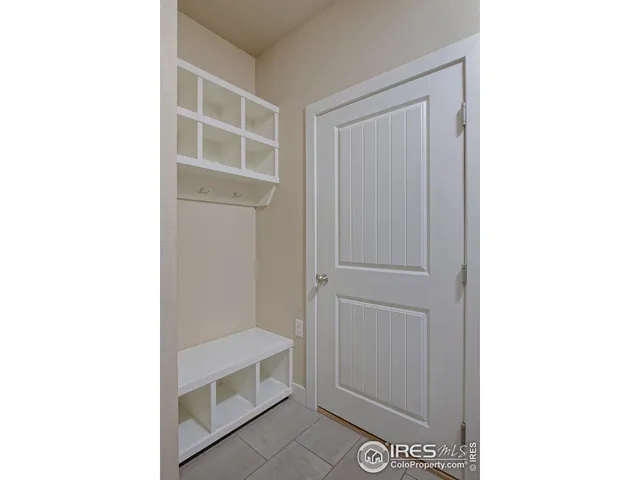 a room with a door and a cabinet