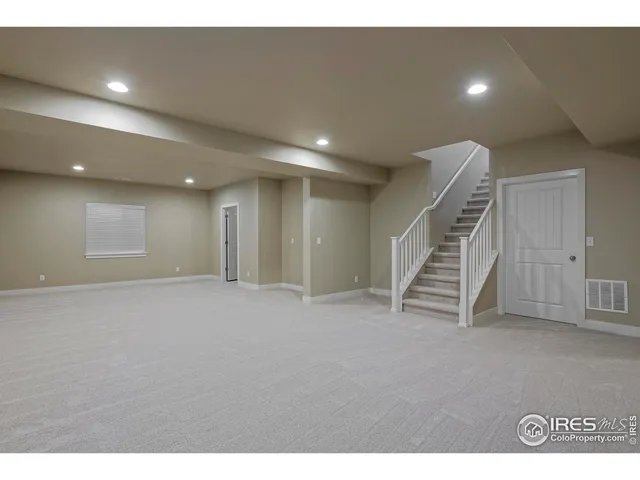 a view of an empty room with stairs