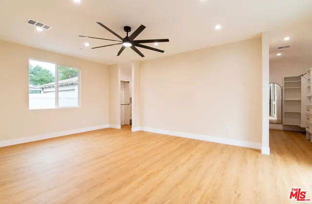 a bathroom with a sink double vanity mirror and a bathtub