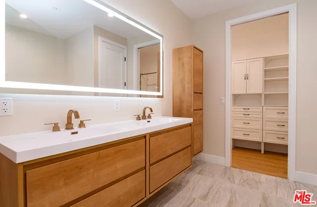 a bathroom with a tub sink and a mirror