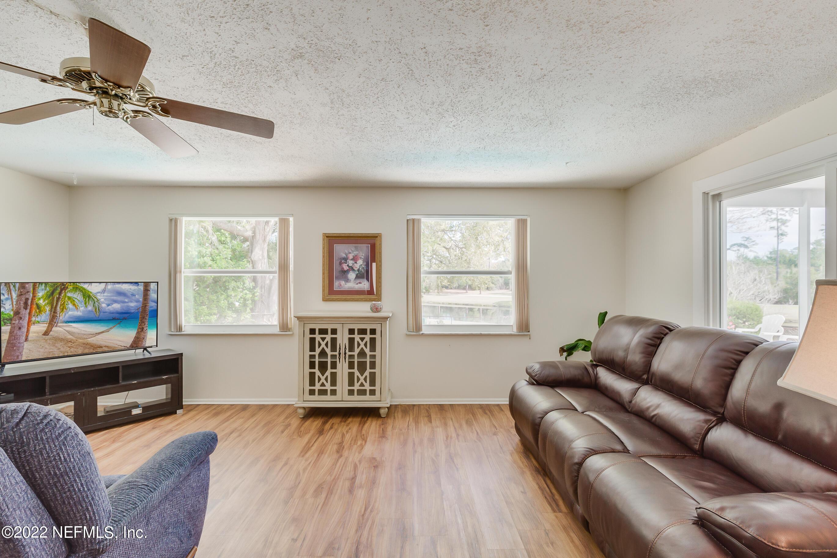 224 Lily Road St. Augustine, FL 32086 - Photo 29 of 52 a living room with furniture and a window