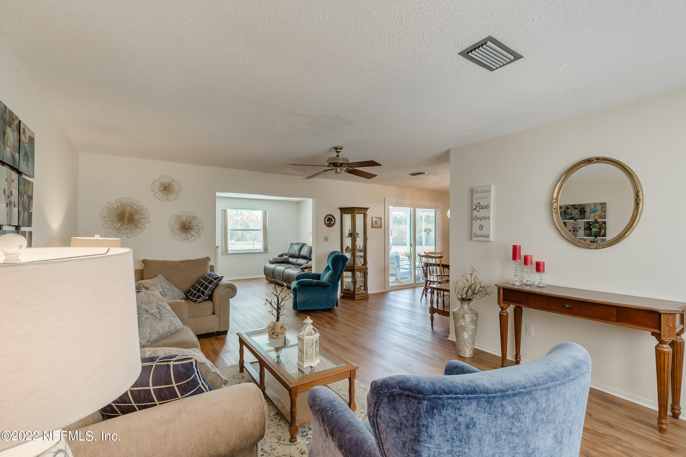 224 Lily Road St. Augustine, FL 32086 - Photo 30 of 52 a living room with furniture and a wooden floor