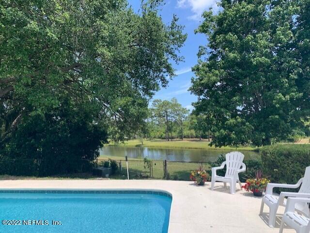 224 Lily Road St. Augustine, FL 32086 - Photo 3 of 52 a view of a fountain with a patio