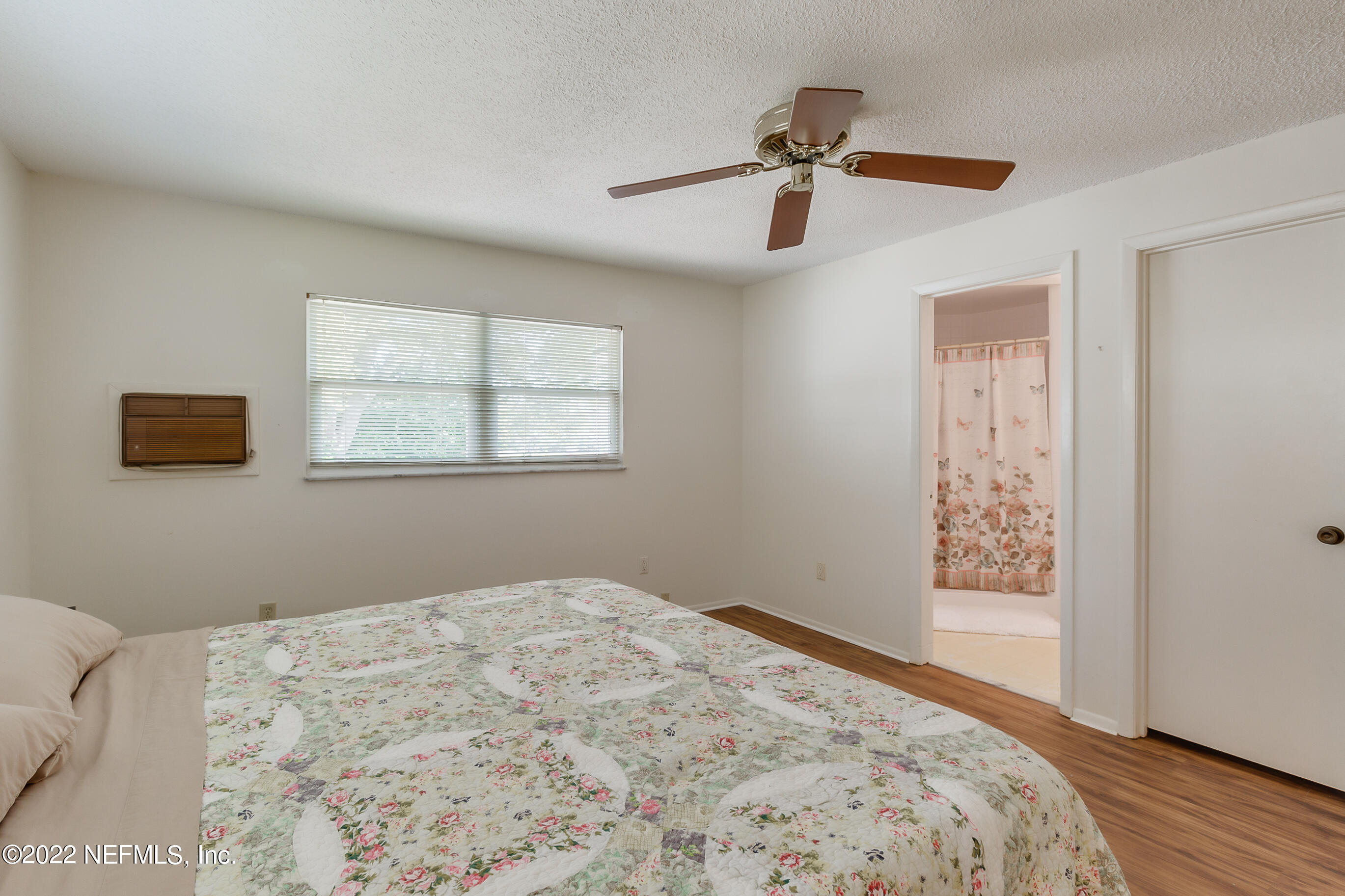 224 Lily Road St. Augustine, FL 32086 - Photo 31 of 52 a bedroom with a bed and a window