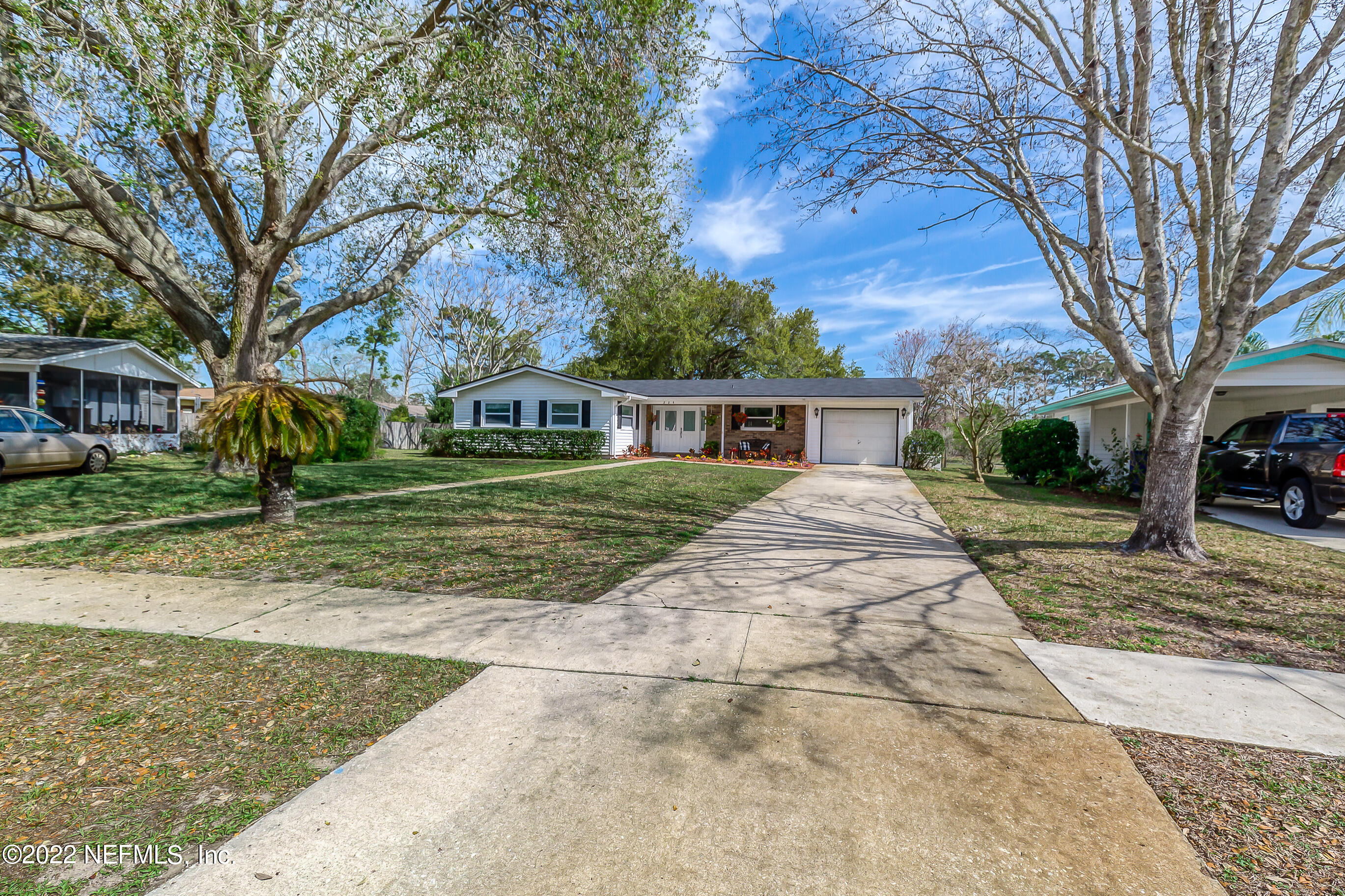 224 Lily Road St. Augustine, FL 32086 - Photo 32 of 52 front view of a house with a yard