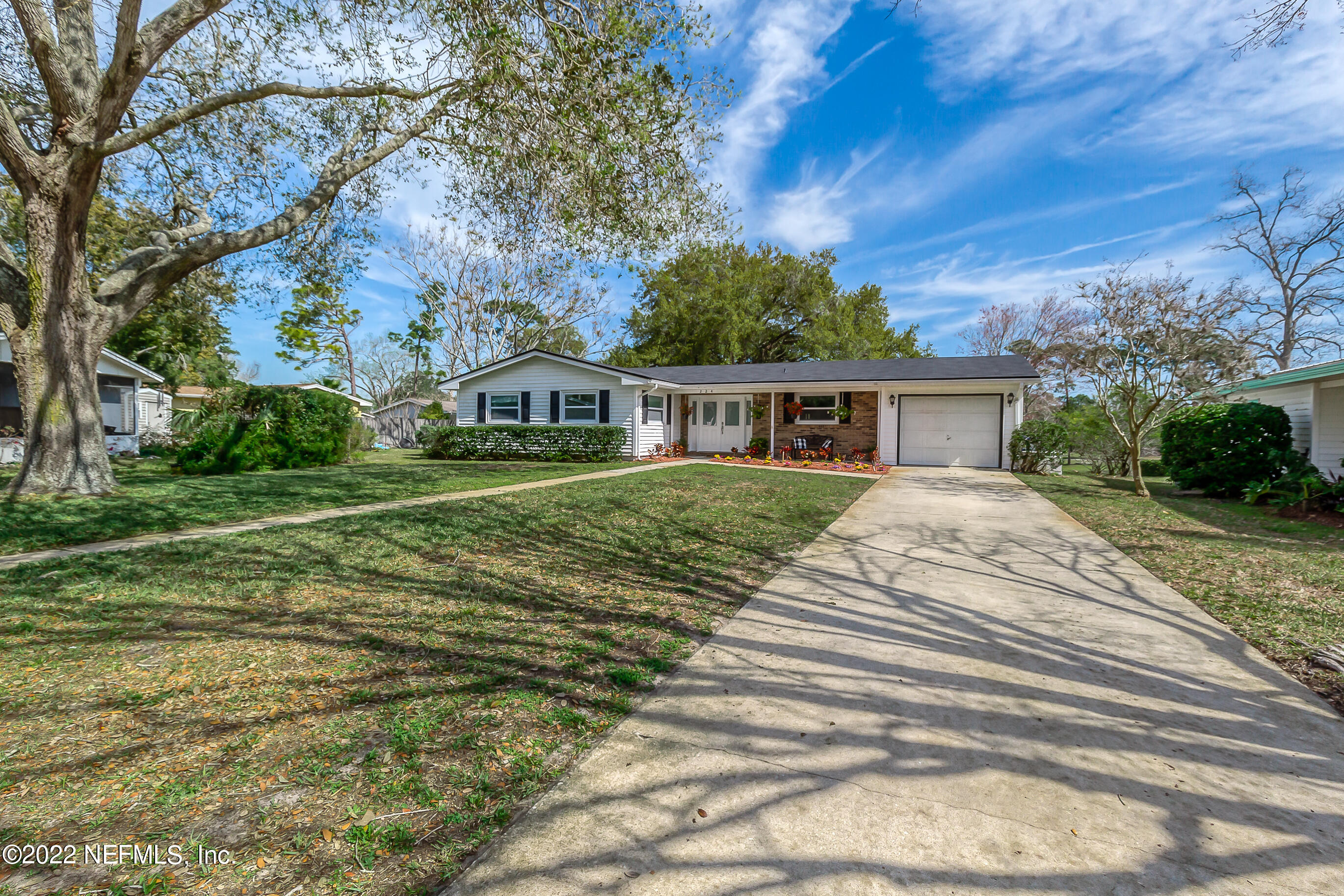 224 Lily Road St. Augustine, FL 32086 - Photo 42 of 52 a view of house with outdoor space and trees around