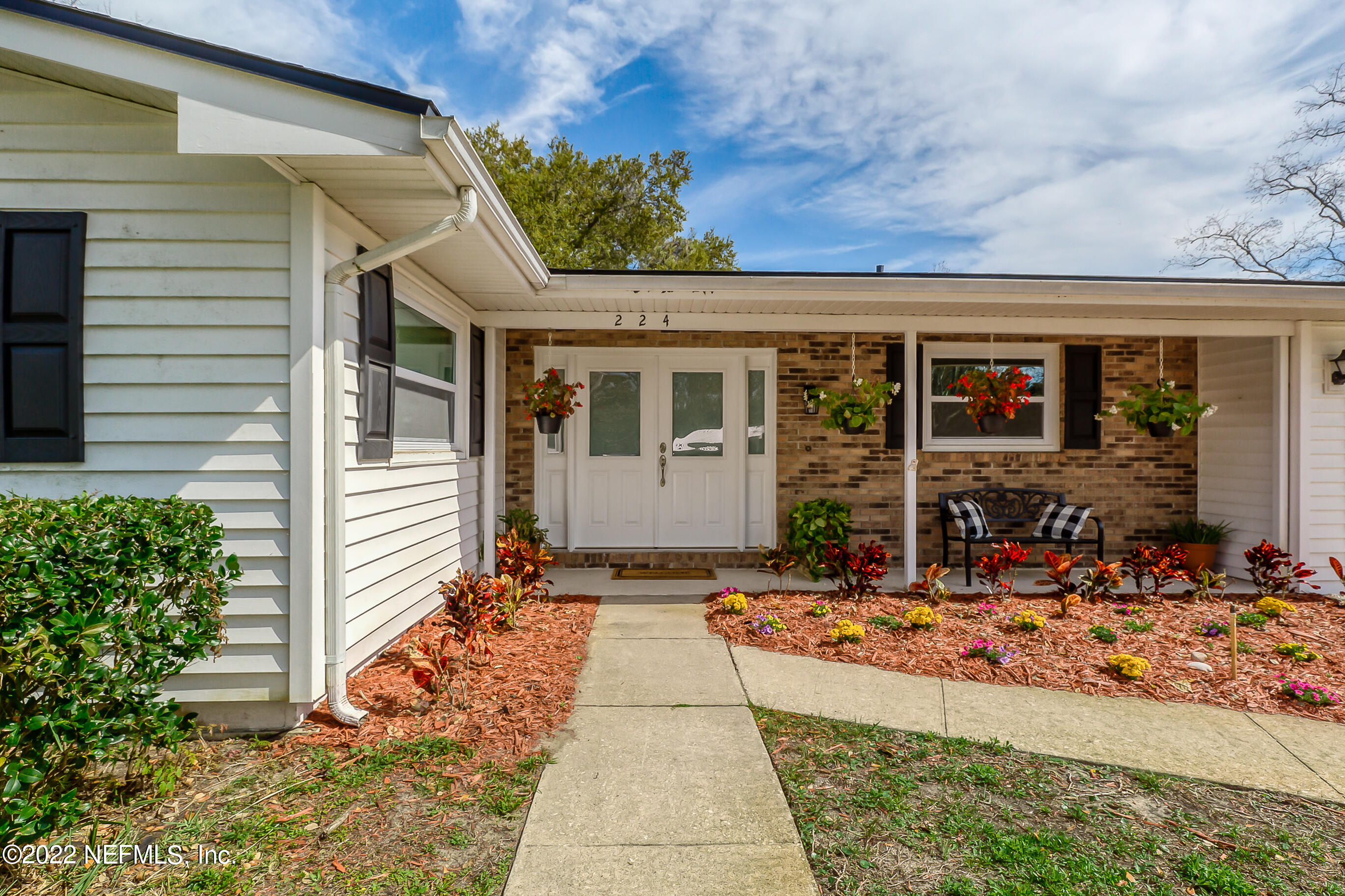 224 Lily Road St. Augustine, FL 32086 - Photo 45 of 52 a front view of a house with porch
