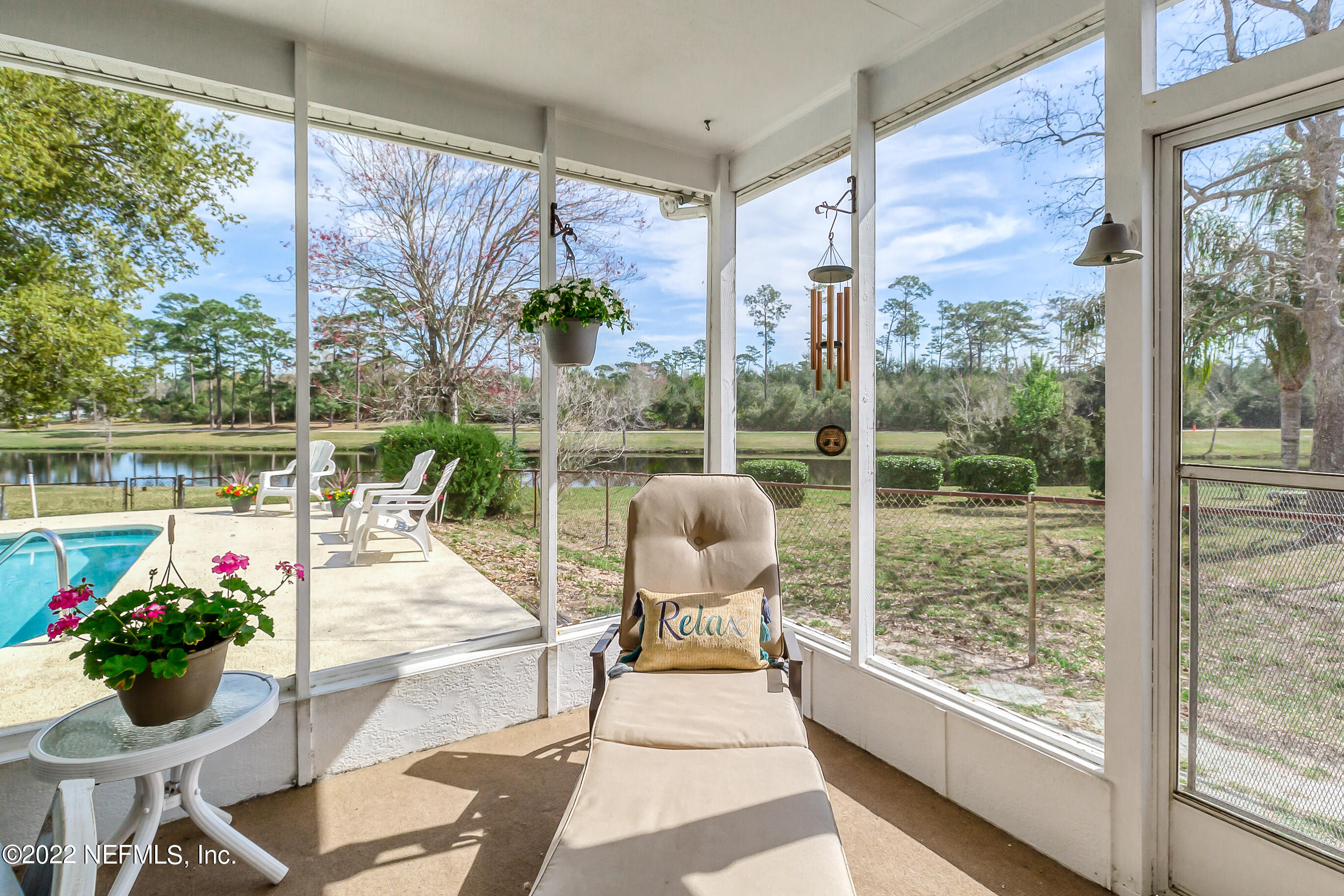 224 Lily Road St. Augustine, FL 32086 - Photo 6 of 52 a living room with furniture and garden view