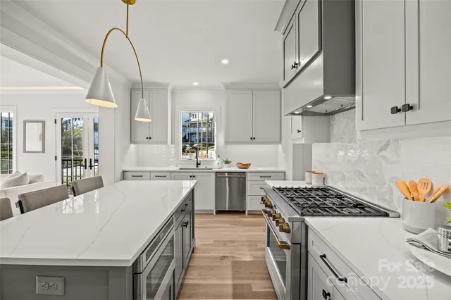 a kitchen with a stove a sink and a refrigerator