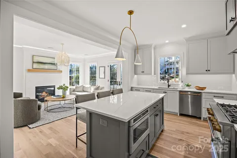 a kitchen with a sink stove and cabinets