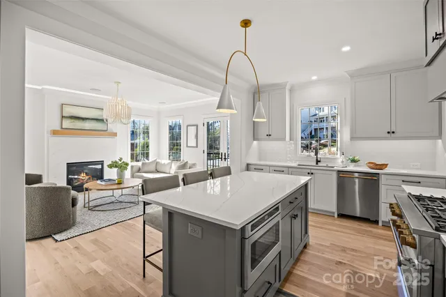a kitchen with a sink stove and cabinets