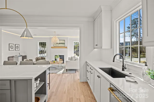 a kitchen with granite countertop a sink and wooden cabinets