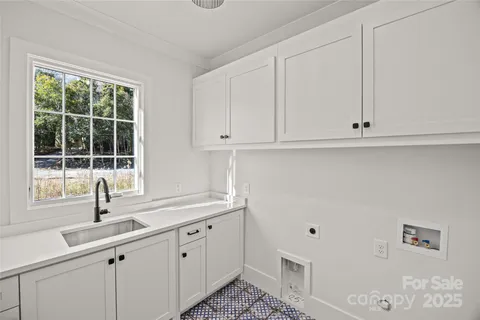 a kitchen with appliances cabinets and a sink