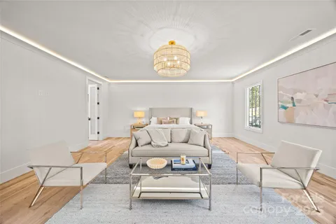 a living room with furniture a rug and a window