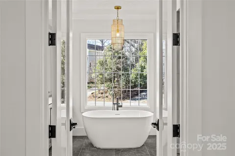 a bathroom with a bathtub and shower