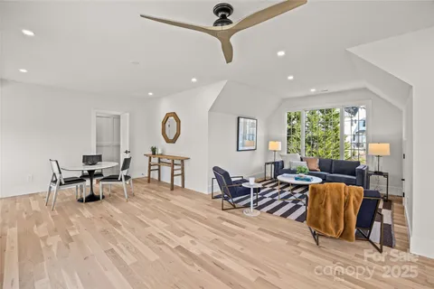 a living room with furniture window and wooden floor