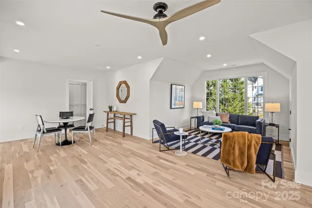 a living room with furniture window and wooden floor