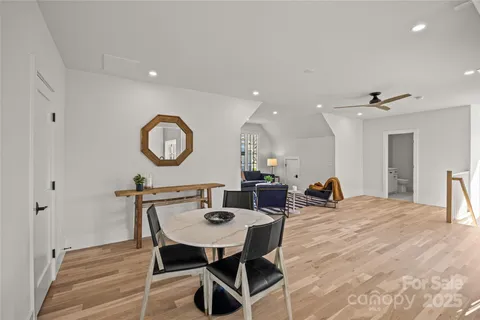 a view of a dining room that has a table and chairs