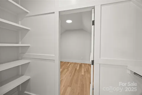 a view of an empty walk in closet