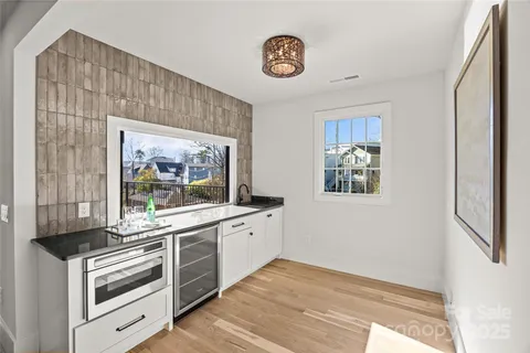 a kitchen with stainless steel appliances a stove and cabinets