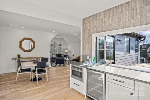 a open kitchen with a sink cabinets and wooden floor
