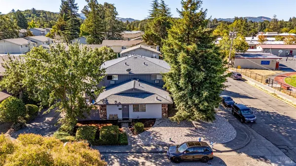 an aerial view of a house with a garden