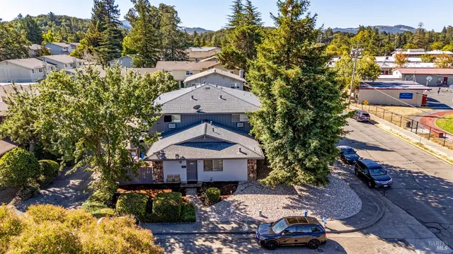 an aerial view of a house with a garden