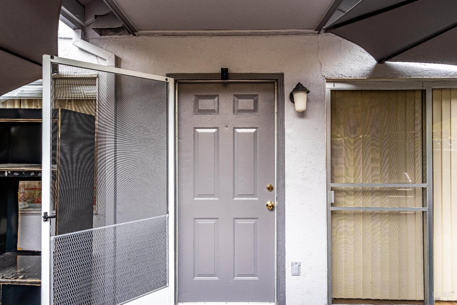 5020 Roma Street Santa Rosa, CA 95409 - Photo 23 of 29 a front view of a house with a glass door