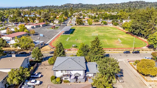 an aerial view of residential houses with outdoor space