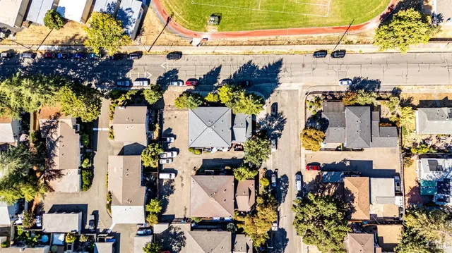 an aerial view of residential houses with outdoor space
