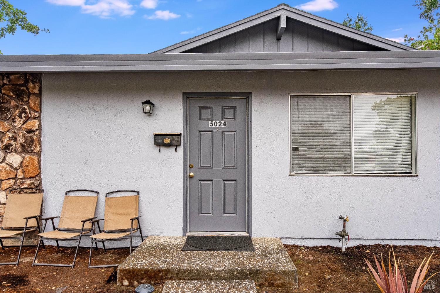 5020 Roma Street Santa Rosa, CA 95409 - Photo 6 of 29 a view of a wooden door and chair