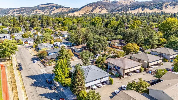 an aerial view of residential houses with outdoor space