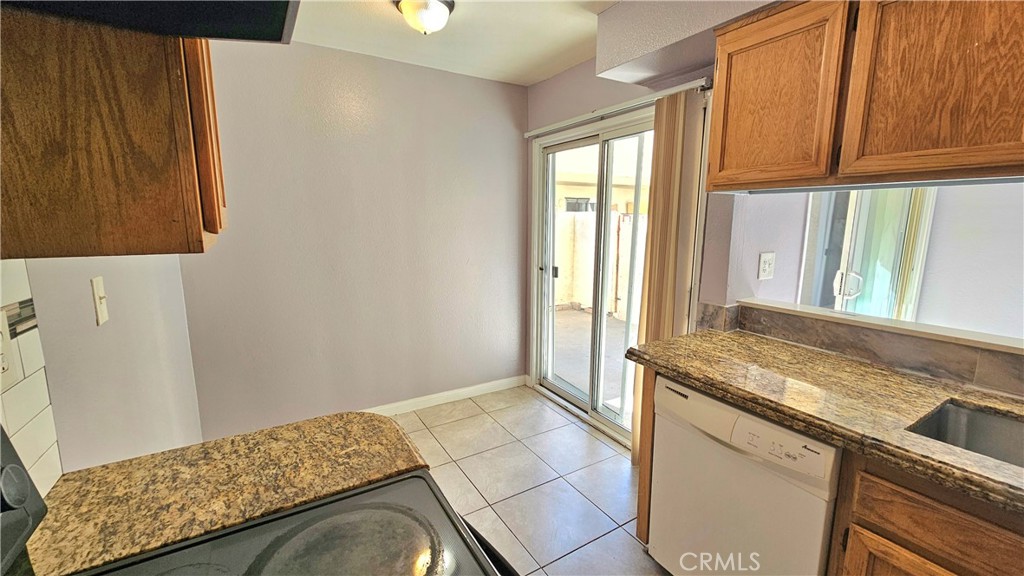 7641 Reseda Boulevard, Unit 87 Reseda, CA 91335 - Photo 12 of 37 a bedroom with a bed and a window