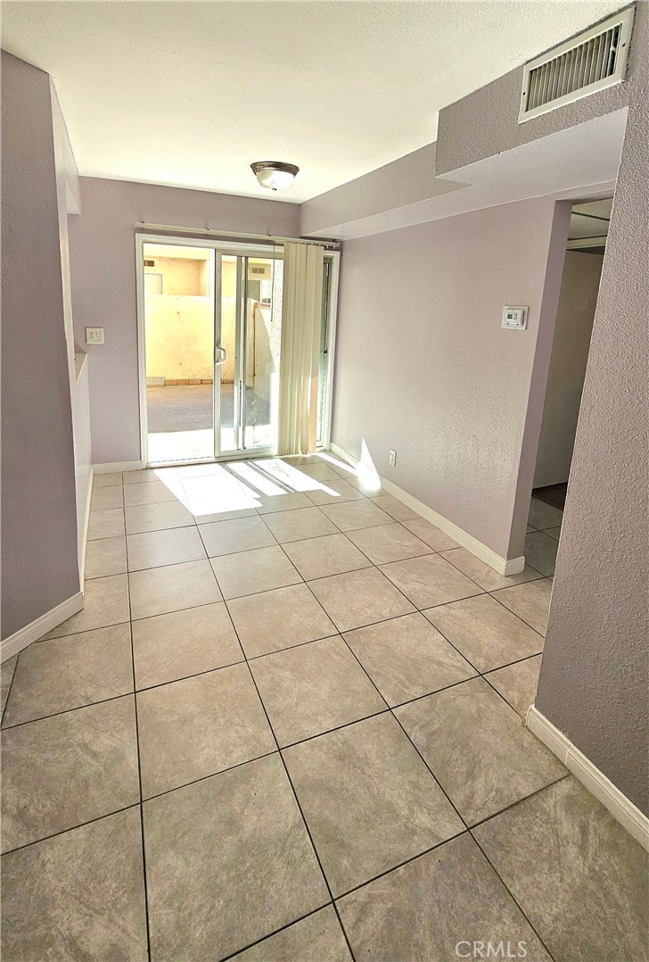7641 Reseda Boulevard, Unit 87 Reseda, CA 91335 - Photo 16 of 37 a view of an empty room with a window