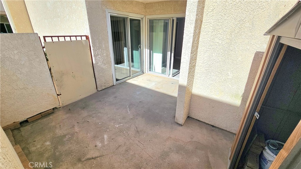 7641 Reseda Boulevard, Unit 87 Reseda, CA 91335 - Photo 29 of 37 a view of a hallway with a white door