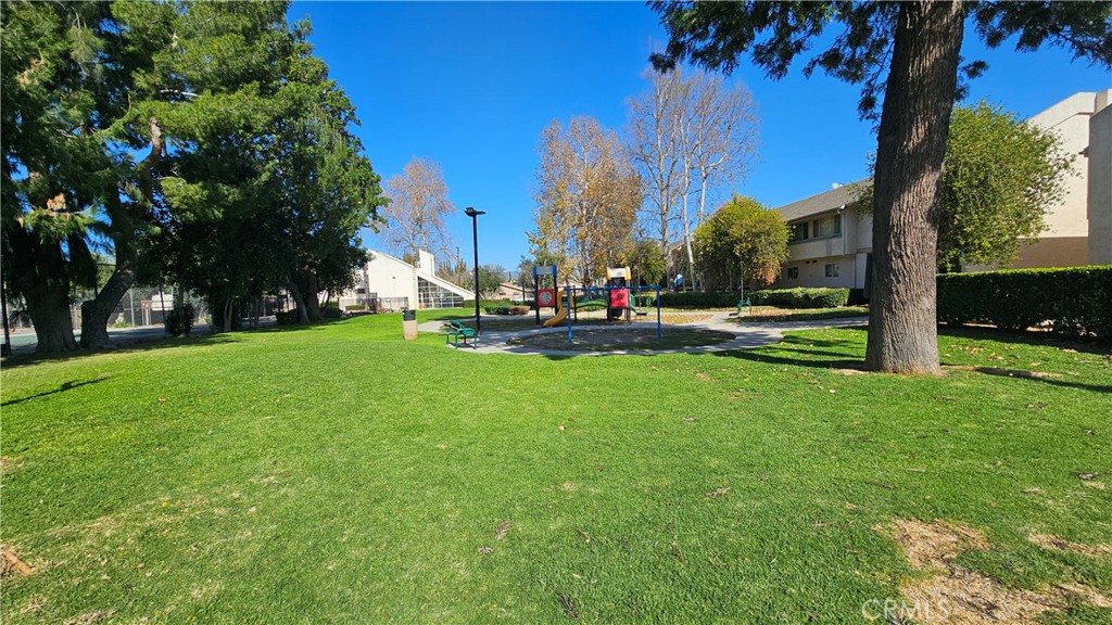 7641 Reseda Boulevard, Unit 87 Reseda, CA 91335 - Photo 33 of 37 a view of a park with large trees
