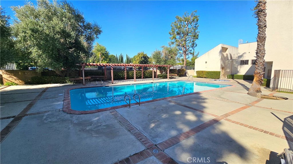 7641 Reseda Boulevard, Unit 87 Reseda, CA 91335 - Photo 35 of 37 a view of a house with a yard