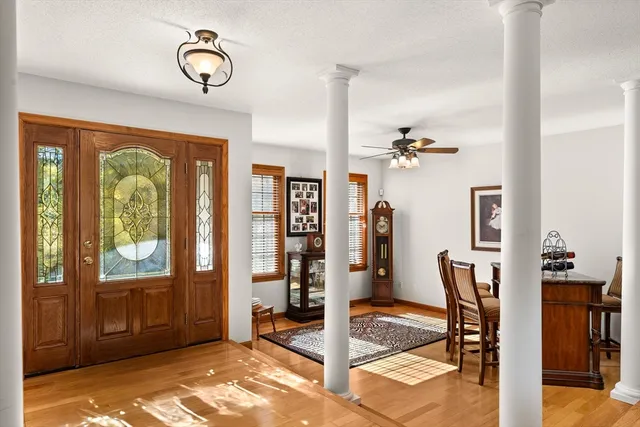 a view of a livingroom with furniture window and wooden floor