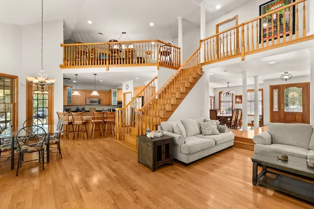 a living room with furniture or kitchen and a wooden floor