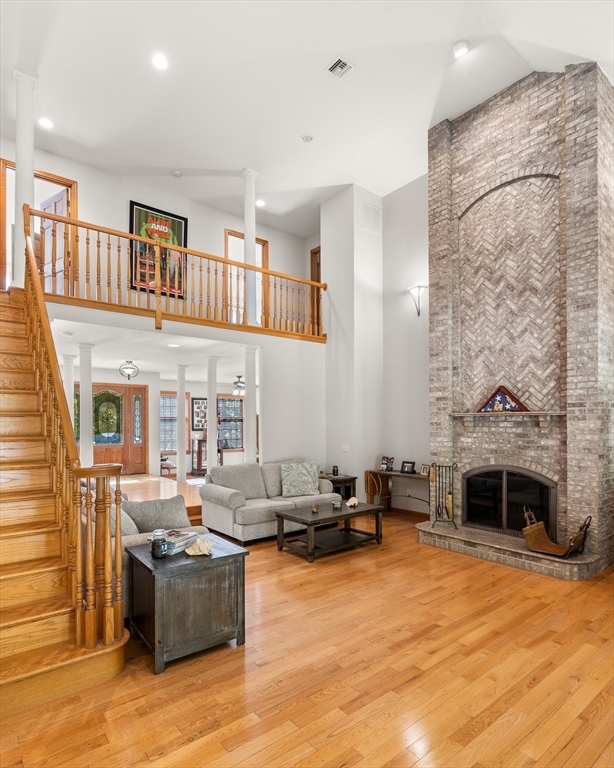 59 St Germain Road Hampden, MA 01036 - Photo 18 of 42 a living room with furniture a fireplace and a flat screen tv