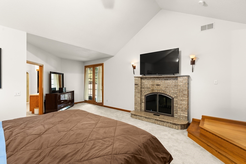 59 St Germain Road Hampden, MA 01036 - Photo 25 of 42 a bedroom with a bed and a flat screen tv