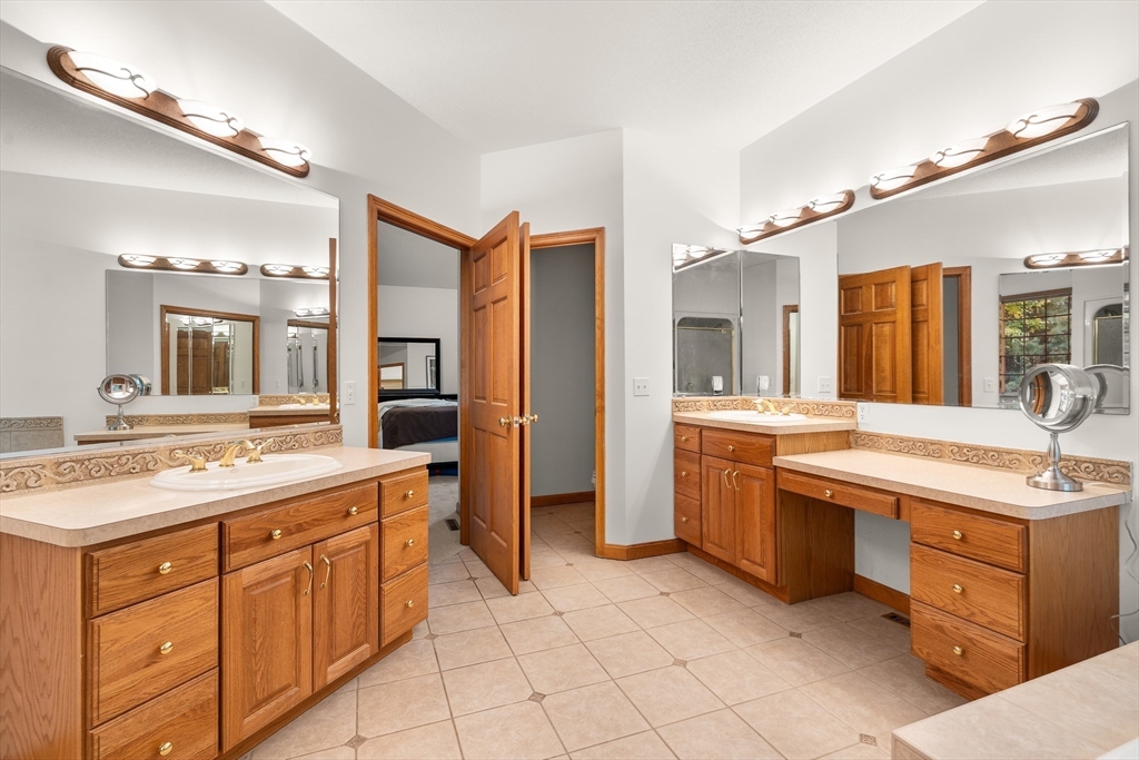59 St Germain Road Hampden, MA 01036 - Photo 29 of 42 a spacious bathroom with a granite countertop sink mirror and