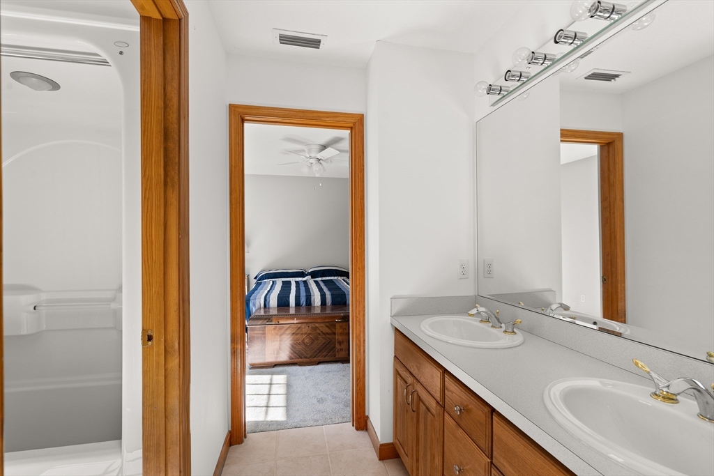 59 St Germain Road Hampden, MA 01036 - Photo 36 of 42 a bathroom with a sink and a mirror