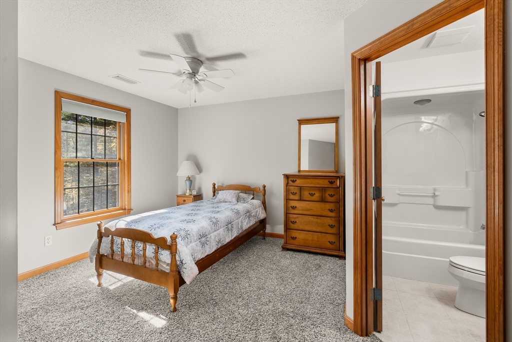 59 St Germain Road Hampden, MA 01036 - Photo 39 of 42 a bedroom with a bed and a ceiling fan